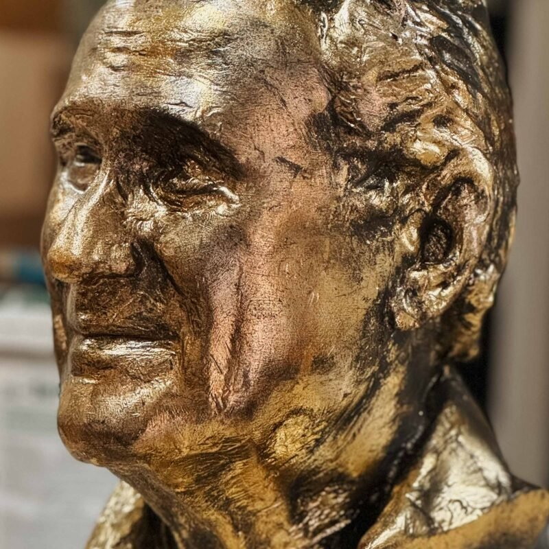 Life-size 3D head sculpture with a gold-plated finish, created as a custom art installation.